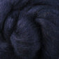 A close-up shot highlights the Corriedale New Zealand Wool Fiber to Spin and Felt by Ashford Handicrafts Limited, showcasing its dark, twisted fibers with detailed texture and depth. Shades of black and navy blue merge beautifully, offering a rich and soft look ideal for felting projects.