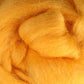 A close-up view reveals the soft, fluffy yellow wool fibers of Ashford Handicrafts Limited's Corriedale New Zealand Wool Fiber to Spin and Felt, tightly packed to highlight their smooth texture and vibrant color. This exquisite felting wool could easily be mistaken for premium quality fiber.