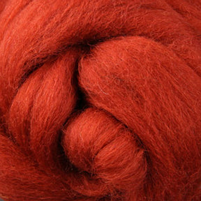 Close-up of a skein of vibrant red Corriedale New Zealand Wool Fiber to Spin and Felt by Ashford Handicrafts Limited, showcasing its soft, fibrous texture and tightly wound strands.