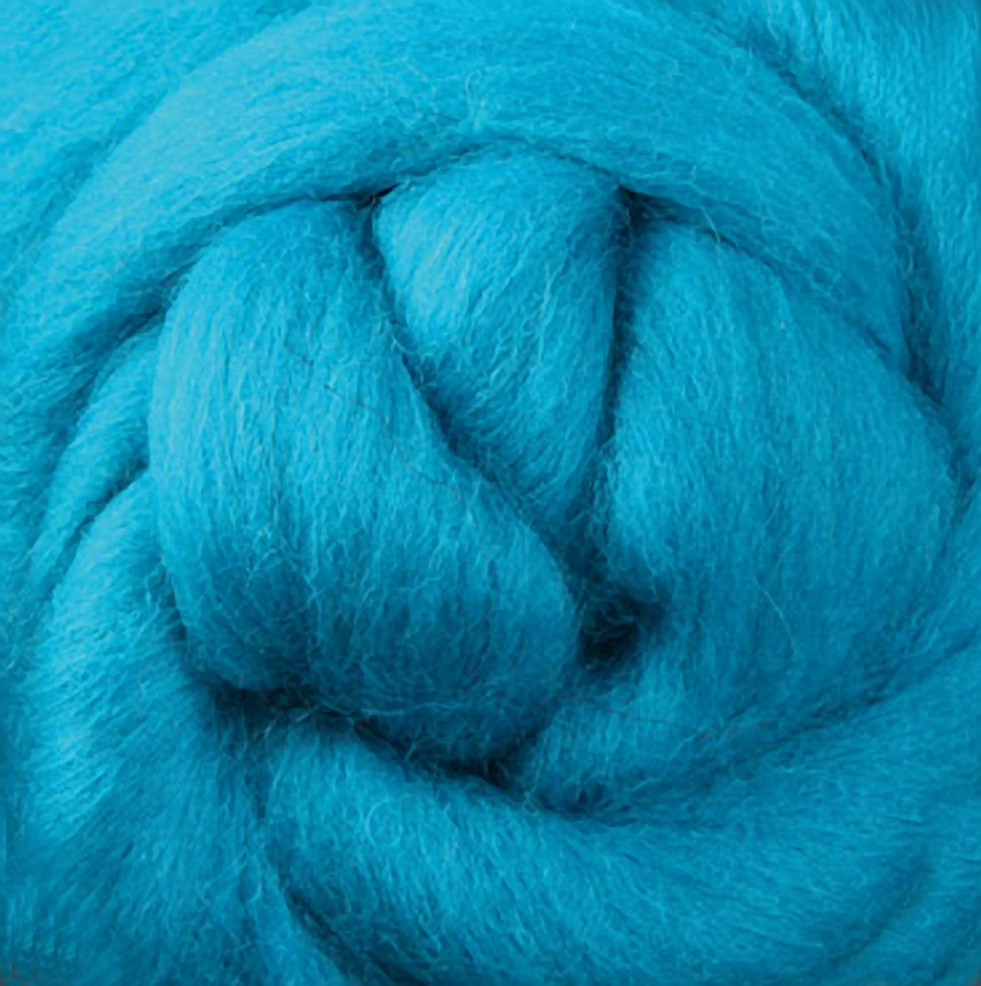 A detailed view of turquoise wool roving, intricately twisted into a thick, smooth braid. Featuring soft and fluffy fibers with vibrant, rich colors—ideal for felting or spinning your yarn from the luxurious Corriedale New Zealand Wool Fiber by Ashford Handicrafts Limited.