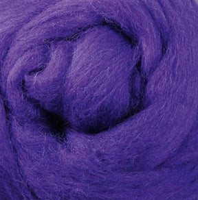 A detailed view of the Ashford Handicrafts Limited Corriedale New Zealand Wool Fiber to Spin and Felt, sold by the ounce, highlights its purple hue and soft, fluffy texture with a swirling pattern. The thick and smooth fibers are ideal for felting or spinning, forming a circular shape within the frame.