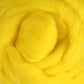 The Corriedale New Zealand Wool Fiber to Spin and Felt by Ashford Handicrafts Limited, available in bright yellow by the ounce, is coiled in a circular pattern and offers a soft, fluffy texture ideal for wool felting projects. Its closely packed fibers create a vibrant, colorful display.