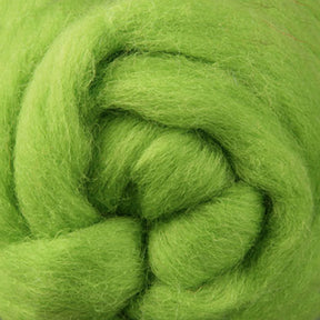 Zoomed-in view of vibrant green fibers from Corriedale New Zealand Wool Fiber to Spin and Felt, offered by Ashford Handicrafts Limited. The fibers are tightly coiled, resembling a soft and fluffy texture perfect for spinning or felting projects.