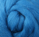 Close-up of vibrant blue Corriedale New Zealand Wool Fiber to Spin and Felt by Ashford Handicrafts Limited, highlighting its soft and fluffy texture. The wool is coiled into a circular pattern, accentuating its fibrous strands—ideal for felting projects.