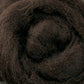 Close-up of a roll of dark brown Corriedale New Zealand wool fiber by Ashford Handicrafts Limited, perfect for felting projects, showcasing its soft, fluffy texture and spiral pattern. The dense fibers are slightly intertwined, highlighting natural color variations typical of this high-quality wool.