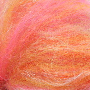 The Merino Silk Top Fiber by Europa Wools Ltd is composed of bright, fluffy fibers in shades of pink, orange, and yellow, creating a soft, multi-colored textured swirl reminiscent of luxury yarn. This colorful wool blend shines with the elegance typically found in silk.