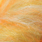 Close-up of the Merino Silk Top Fiber from Europa Wools Ltd, showcasing a fluffy texture in soft shades of orange, yellow, and pale beige. The interwoven fibers resemble luxury yarn, creating a warm, fuzzy appearance.