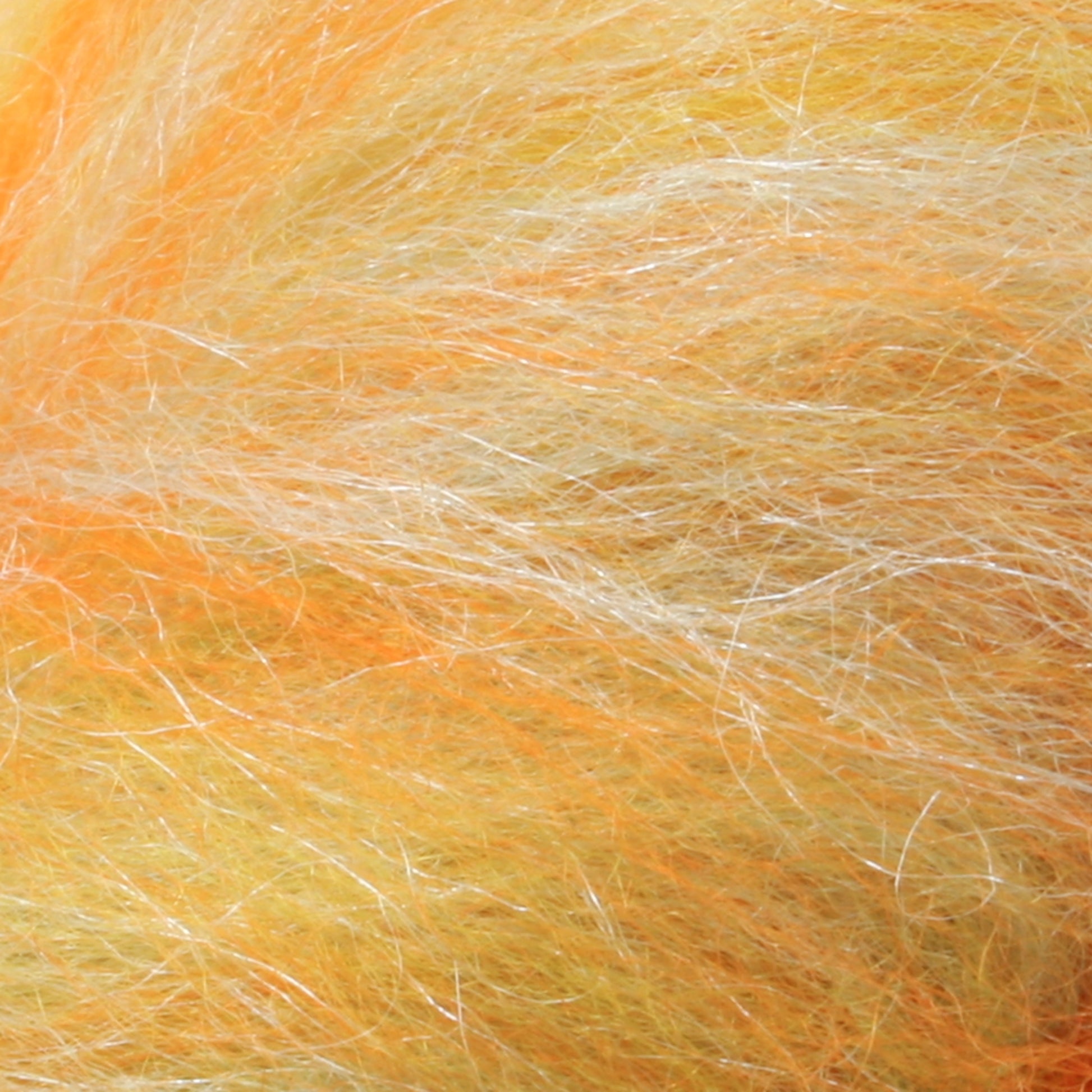 Here's a detailed look at the orange, yellow, and white fibers of the Merino Silk Top Fiber by Europa Wools Ltd, showcasing its soft and fluffy texture that evokes the luxury of merino wool.