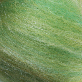 Close-up of fluffy, fibrous green strands from the Merino Silk Top Fiber by Europa Wools Ltd, showcasing subtle variations in shades of green and light reflections.