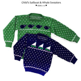 Two children's pullover sweaters from Yankee Knitter Designs are on display. The green sweater features a pattern of whales and white dots, while the navy blue sweater showcases sailboat designs and white dots. Both are marketed as "Child's Sailboat & Whale Pullover Sweaters, download" and are available in sizes 2-12.