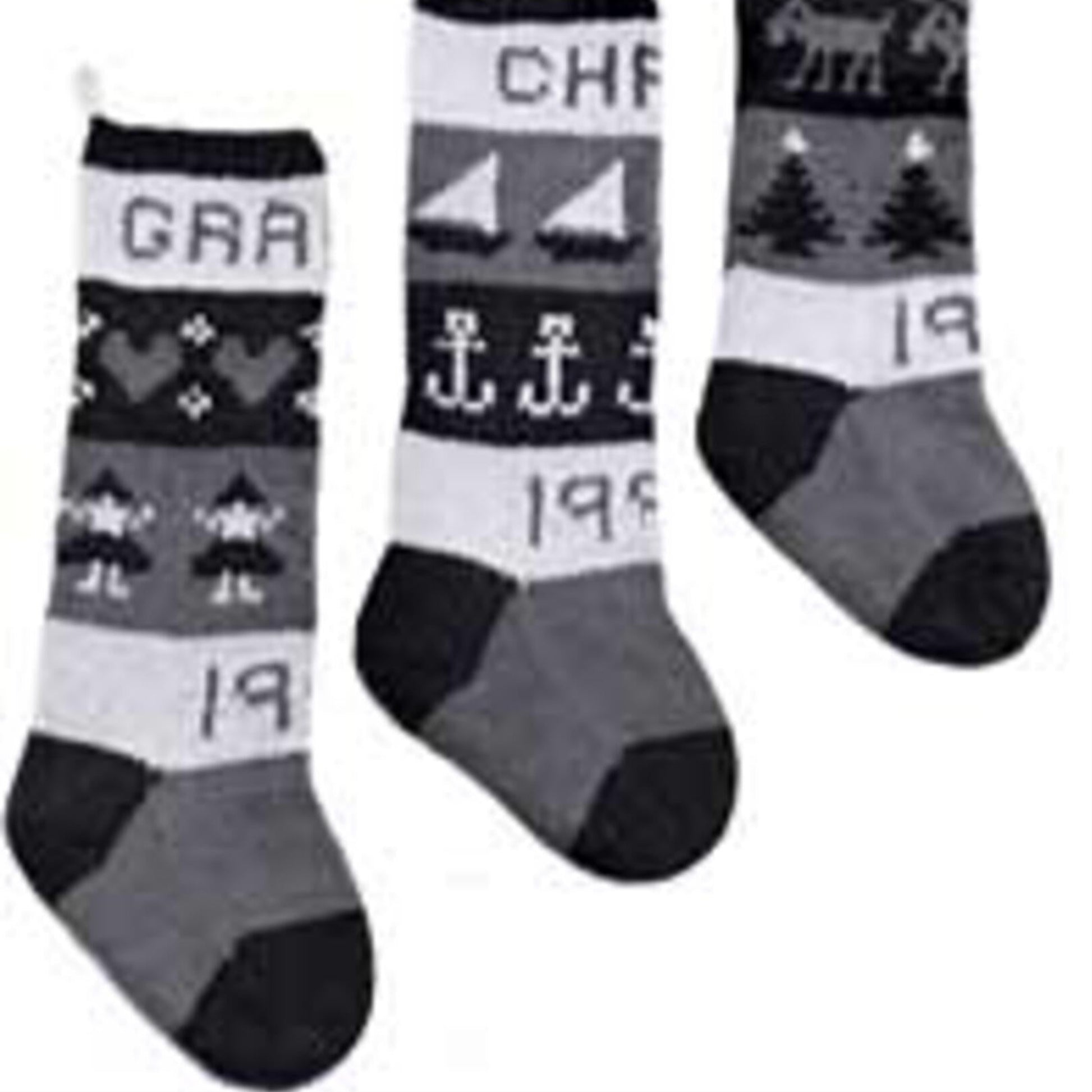 Three Classic Christmas Stockings from Yankee Knitter Designs, each boasting unique patterns. The first showcases the text "GRA" with holiday motifs like hearts and reindeer. The second features "CHA" along with nautical designs of boats and anchors. The third, crafted from worsted weight yarn, displays "RIS" with motifs of trees and reindeer.