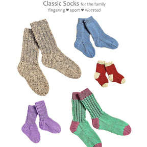 An assortment of Yankee Knitter Designs' Classic Socks in various sizes and colors are displayed. The colors include beige, blue, red with cream accents, purple, and teal with pink accents. Text above reads, "Classic Socks for the family from baby to adult: fingering ♥ sport ♥ worsted.