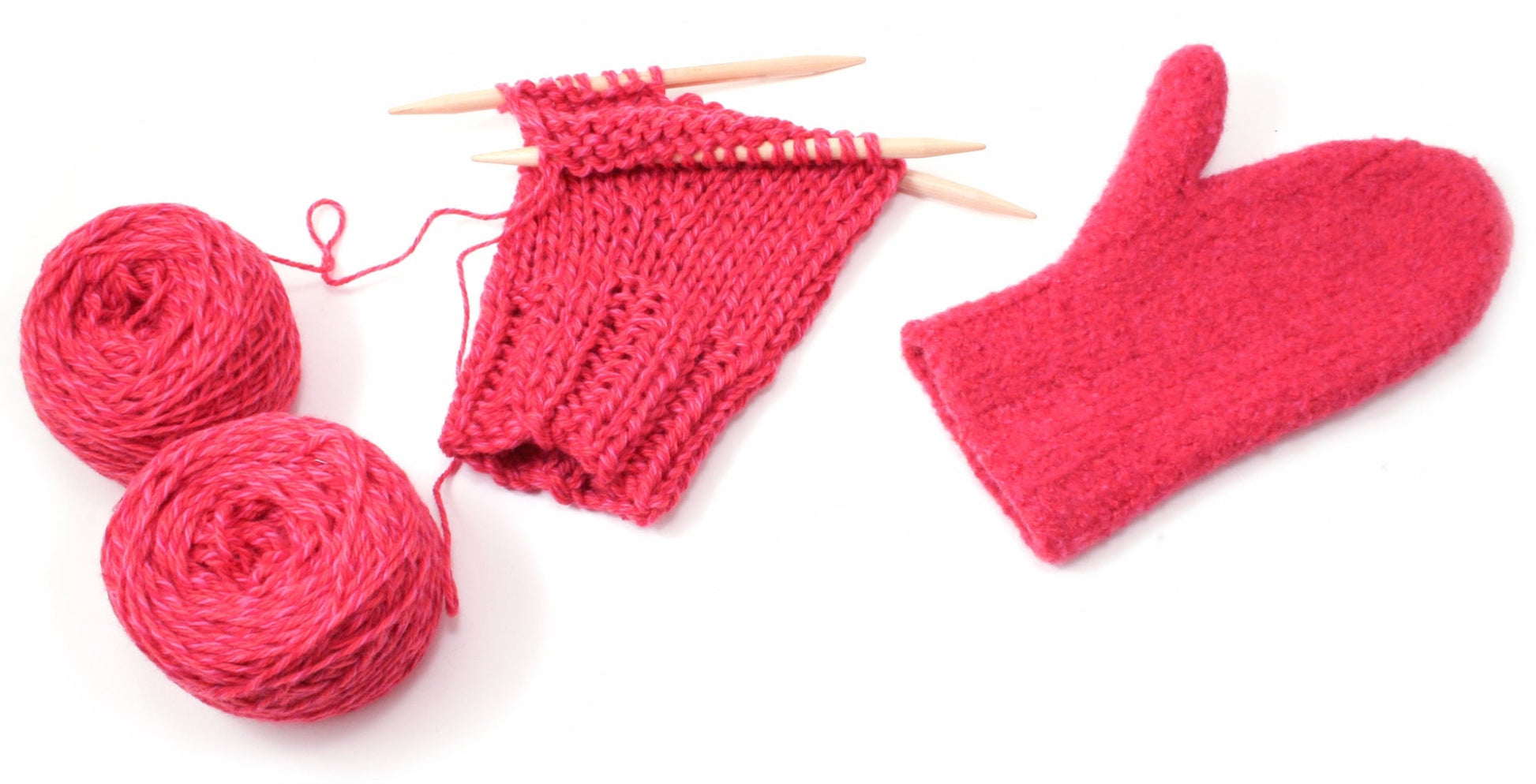 A partially completed red knitting project on wooden needles, accompanied by two balls of thick, textured red yarn from Bryson Distributing, Inc., sits alongside a single finished Snow Country Felt Mitten. The cozy appearance of the yarn makes it perfect for creating these mittens designed for both women and men. The scene is set against a crisp white background.