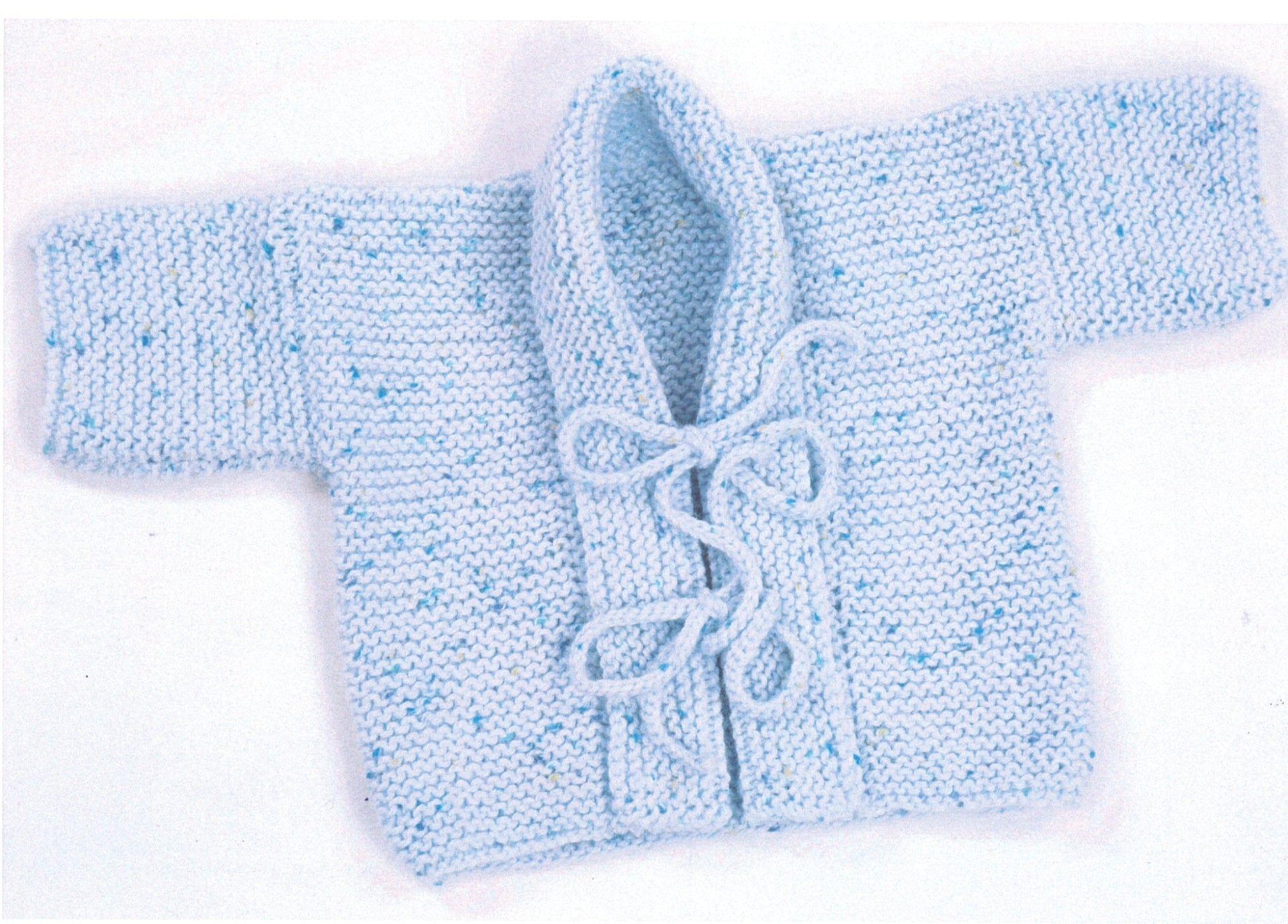 The Plymouth Yarn Co Baby Kimono is a small, hand-knitted baby cardigan in light blue yarn with speckles of darker blue. This stylish piece features long sleeves, a fold-over collar, and ties at the front for fastening. The knitting pattern showcases a dense, textured garter stitch.