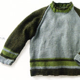 The Wyatt Pullover by Knit One, Crochet Too is a knitted raglan sweater with a dark green body complemented by light blue sleeves and accents. It features a ribbed neckline, cuffs, and hem and includes contrasting stripes in green and blue on both the body and sleeves. The soft and cozy texture makes it perfect for kids.