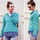 A woman with her hair in a bun is wearing the Barnaby V-Neck with Collar by Kelbourne Woolens, a light blue ribbed pullover sweater over a floral-patterned shirt, paired with light gray pants. She is standing against a light-colored wall, looking up in one image and to the side in the other image.