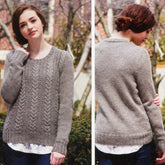 Front and back views of a model wearing the Gillam Pullover by Kelbourne Woolens, a light gray textured knit sweater made with DK weight yarn. Featuring a subtle chevron and cable pattern on the front, this pullover is knit from the bottom up. The model, with short wavy brown hair, stands outdoors amidst trees, layering it over a white shirt.