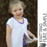 A young child with curly hair and a green mark on their cheek is smiling while wearing Bryson Distributing, Inc.'s Girl's Cap Sleeve Cardi Vest in white over a purple shirt. They are standing in front of some greenery. The text "Knitting Pure & Simple" is written vertically on the right side of the image.