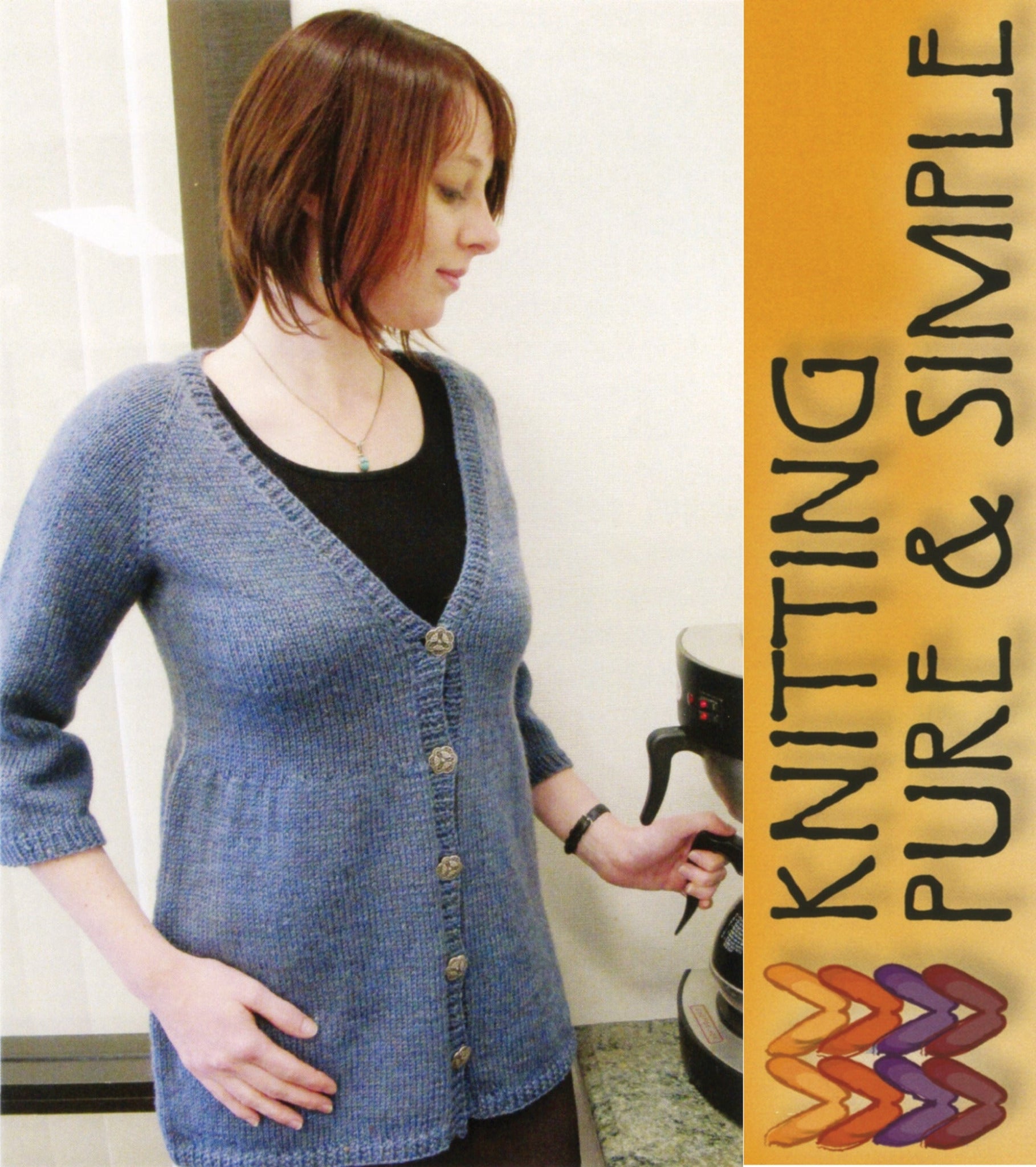 A woman with shoulder-length auburn hair wears the Neck Down Swing Cardigan, a long, blue, buttoned garment from Bryson Distributing, Inc., over a black top. She stands next to a coffee machine, twisting a knob. Text on the right reads "Knitting Pure & Simple" next to a colorful knitted pattern illustration featuring all-season wear designs.