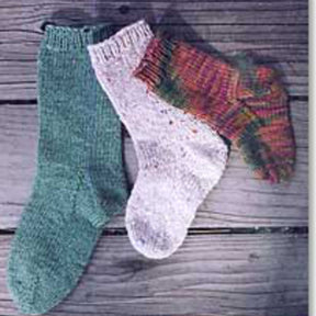 Three Easy Child Socks by Bryson Distributing, Inc. arranged on a wooden surface. The socks are stacked in a way that highlights one of each style: green, white with colored speckles, and a vibrant multicolored blend of reds, greens, and yellows—ideal for kids.