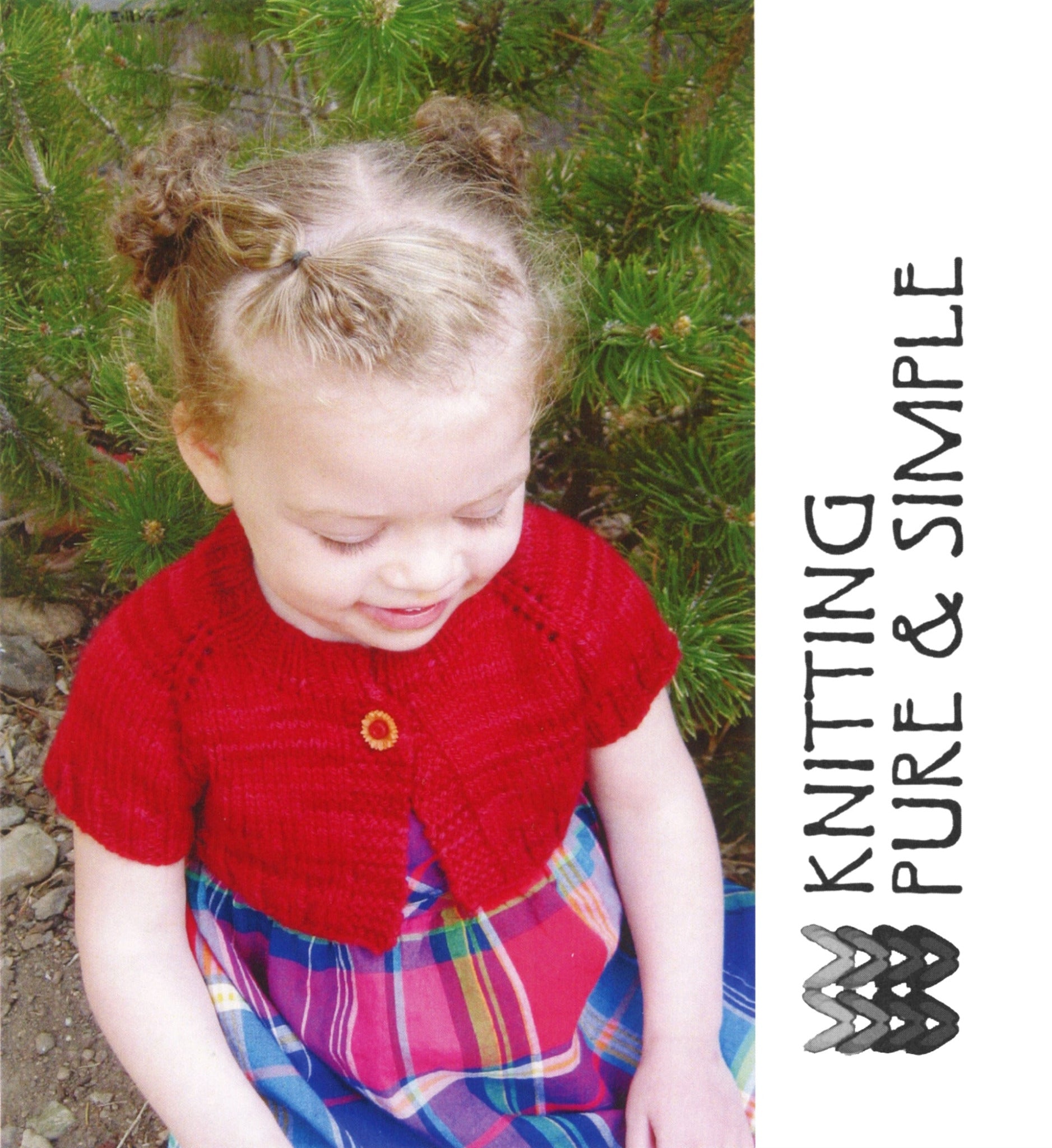 A young child with light hair in buns sits outdoors near green foliage, wearing a red knitted "Little Girl's Shrug" by Bryson Distributing, Inc. and a colorful plaid sundress. The right side of the image features the text "KNITTING PURE & SIMPLE" alongside a knitting needles logo.