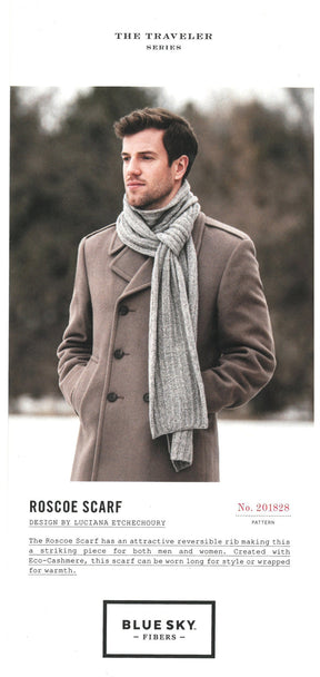 A man wearing a camel-colored coat and a gray scarf stands against a blurred, natural background. The text below the image describes the Roscoe Scarf by Blue Sky Fibers, highlighting its versatile reversible rib design for men and women, made with Eco-Cashmere for warmth.