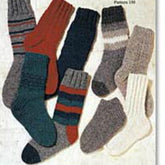 The Country Classic Sox Pattern collection by Halcyon Yarn showcases a variety of knitted socks in an array of vibrant colors and intricate patterns. These heavy-weight socks feature solid colors such as red, green, and navy, alongside striped and ombre designs in shades of gray, white, and red. Available in multiple sizes, this collection includes a total of eight socks.