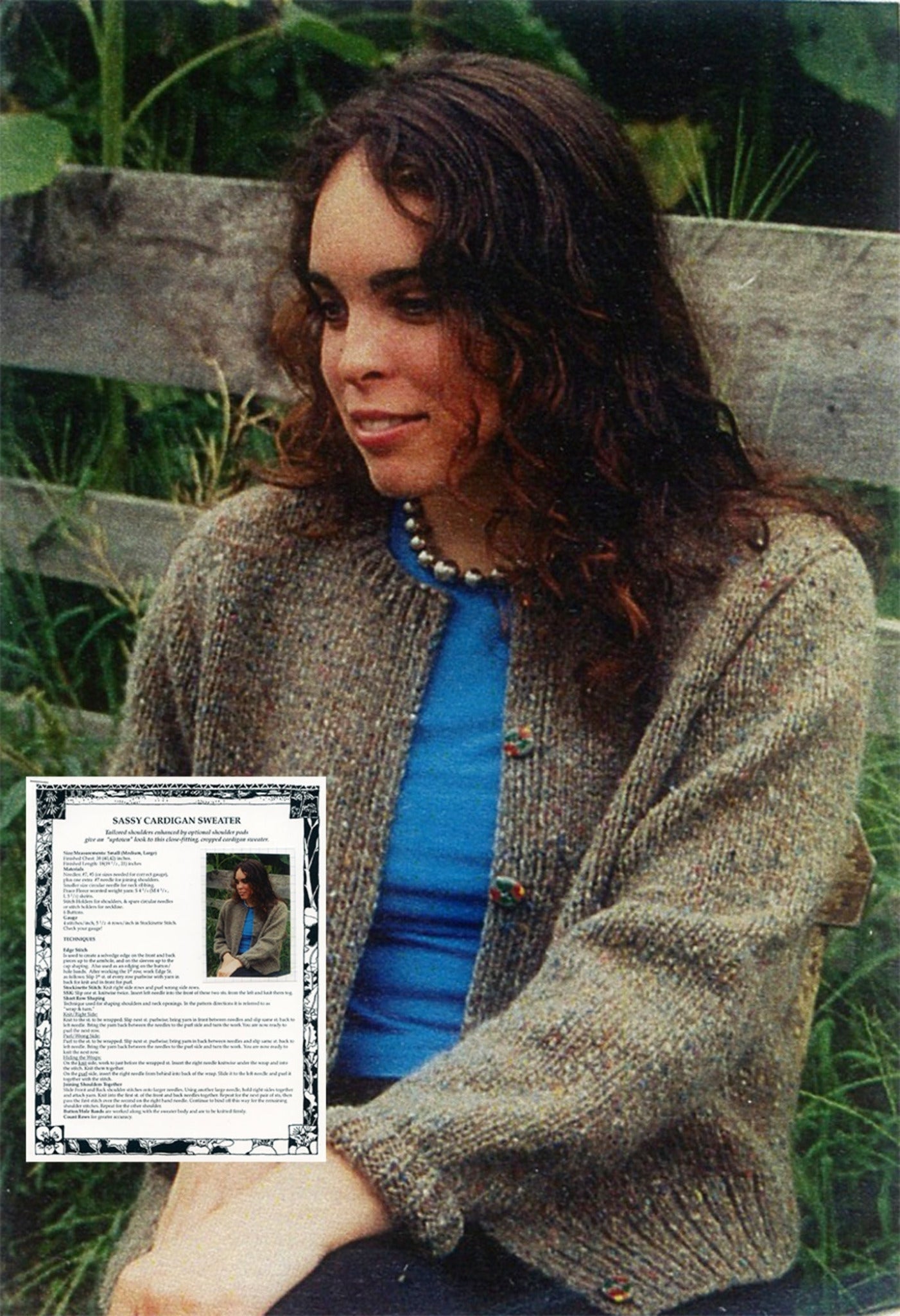 A woman with long, curly hair sits outdoors next to a wooden fence, wearing the Harrisville Designs Sassy Cardigan Sweater over a blue top, and a beaded necklace. She sports an uptown look with tailored shoulders on her cardigan. In the bottom-left corner, there's an inset image of a knitting pattern titled "Sassy Cardigan Sweater" featuring the same woman.