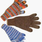 Three "A Basic Glove" by Lisa's Knits are displayed on a plain background. The glove in the upper left, made from sock yarn, has colorful horizontal stripes. The glove in the top right is solid brown, while the glove in the bottom left features blue and gray stripes. All gloves have a five-finger design for added comfort.