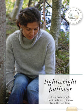 A woman is sitting outdoors on the ground in a forest, wearing a light gray Knitbot Lightweight Pullover from Never Not Knitting and jeans. She looks down with a peaceful expression. Text overlay reads: "Lightweight pullover - A wardrobe staple, knit top down in dk weight yarn from the top down.