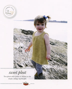 A young girl stands outdoors on a rocky surface near a body of water. She is wearing the Knitbot Sweet Pleat, a sleeveless, mustard-colored swingy top from Never Not Knitting, paired with striped leggings. The top, knit in the round, flows beautifully as she moves. The text at the bottom reads "sweet pleat," describing the garment's charming design elements.