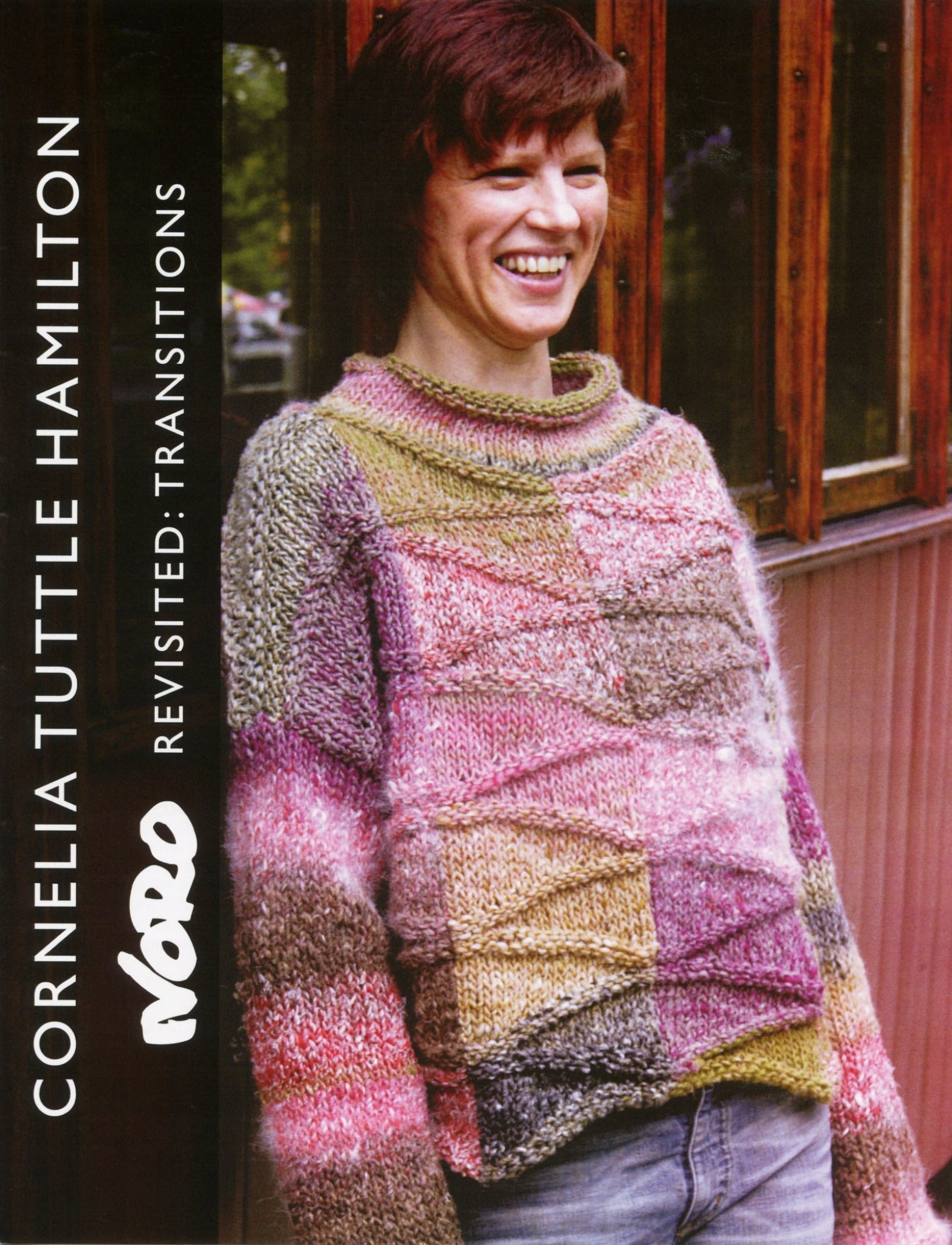 A person with a cheerful expression is donning a Skeppsta Sweater, made from vibrant Noro Transitions yarn, and stands before a wooden building. The text on the left reads "Knitting Fever / Euro Yarns: Noro Revisited: Skeppsta Sweater.