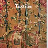 The product "Textiles in the Art Institute of Chicago" by Lacis features an intricate tapestry depicting a rider on an ornate, elaborately decorated elephant surrounded by lush, intertwining vines and floral patterns. The word "Textiles" is prominently displayed at the top, reminiscent of exhibits at the Art Institute of Chicago showcasing textile arts.