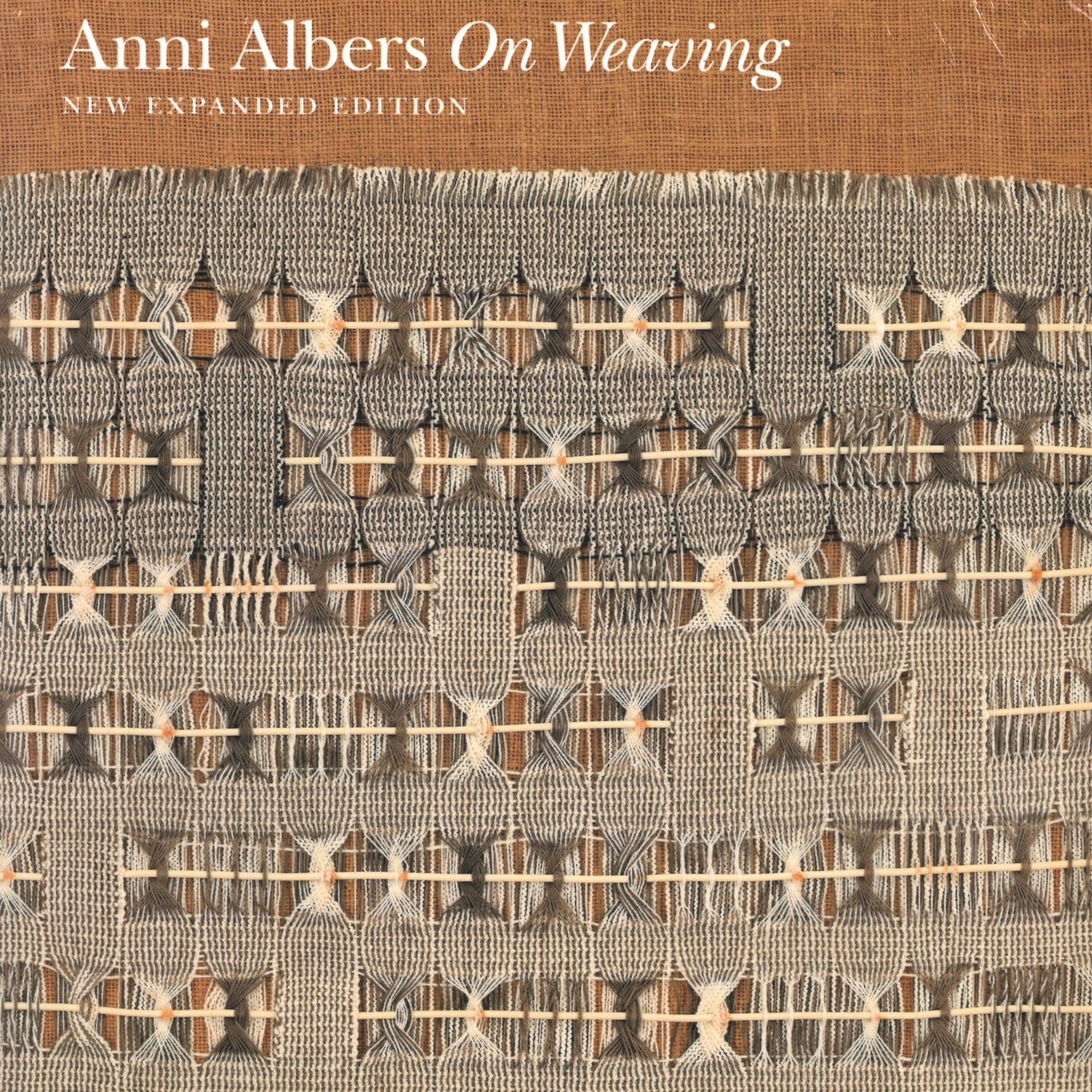 Cover of the book "On Weaving - New Expanded Edition" by Anni Albers, published by Ingram Content. The Bauhaus-inspired cover showcases a woven textile design featuring a blend of intricate patterns in beige, brown, and gray tones. The title and author’s name are positioned at the top in a white sans-serif font on a brown background.