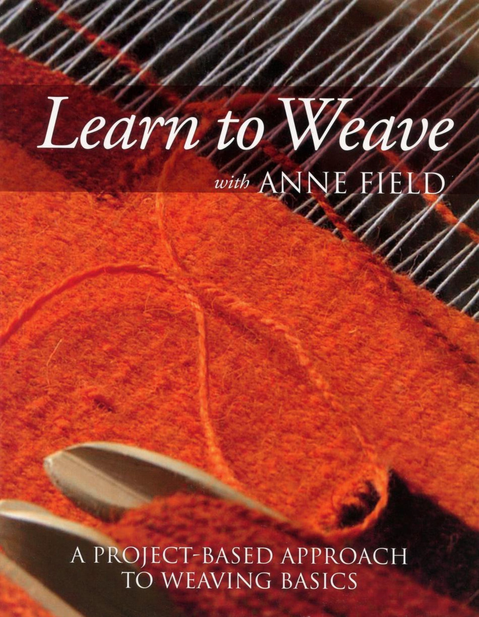 Cover of "Learn to Weave with Anne Field" by Ingram Content. It features a close-up of a weaving loom, showcasing orange-red yarn, with the title text overlayed on the image. Perfect for those interested in mastering weaving projects on shaft looms.