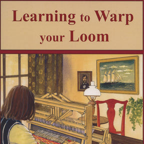 A person with shoulder-length hair is seen from behind, sitting at a loom inside a room. The loom from Glimakra has a colorful pattern being woven using the beginner's technique from "Learning to Warp Your Loom." The room features a window with curtains, a framed painting of a ship, a wooden chair, and a table lamp. The text above reads, "Learning to Warp Your Loom.