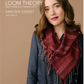 A person with long brown hair is dressed in a dark blue outfit, complemented by a red woven scarf. The text displays "Long Thread Media HANDWOVEN LOOM THEORY Rigid-Heddle Scarf Collection 2019, SANGRIA SUNSET, JUDY PAGELS." The background features a neutral tan color.