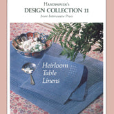 A book cover titled "Handwoven Design Collection 11- Heirloom Table Linens - eBook printed copy" from Long Thread Media features a photo of blue woven table linens displayed on a floral tablecloth. A bowl of candies and a fern are also on the table. The text reads "Heirloom Table Linens.