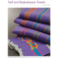 The Handwoven Special Pattern Collection – 5 Towels on 4-Shafts by Long Thread Media is neatly stacked, featuring colorful geometric designs in twill and basketweave patterns. The towels display rich purple shades and vibrant accents, highlighting intricate craftsmanship against a plain white background.