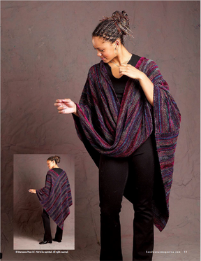 A person wearing a vibrant, striped shawl stands confidently against a textured background, with the shawl draping elegantly around their shoulders. The shawl is part of the Handwoven Design Collection #19 from Long Thread Media and pairs beautifully with black pants. An inset image reveals the back view of this exquisitely woven project.