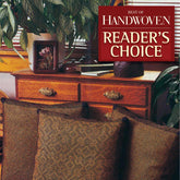 A cozy room with woven pillows in the foreground highlights intricate weaving techniques. The scene features a wooden dresser adorned with potted plants, while the "Reader's Choice" banner for the *Best of Handwoven, Reader's Choice: Top Ten Projects from 30 Years of Handwoven* by Long Thread Media is displayed in the upper right corner.