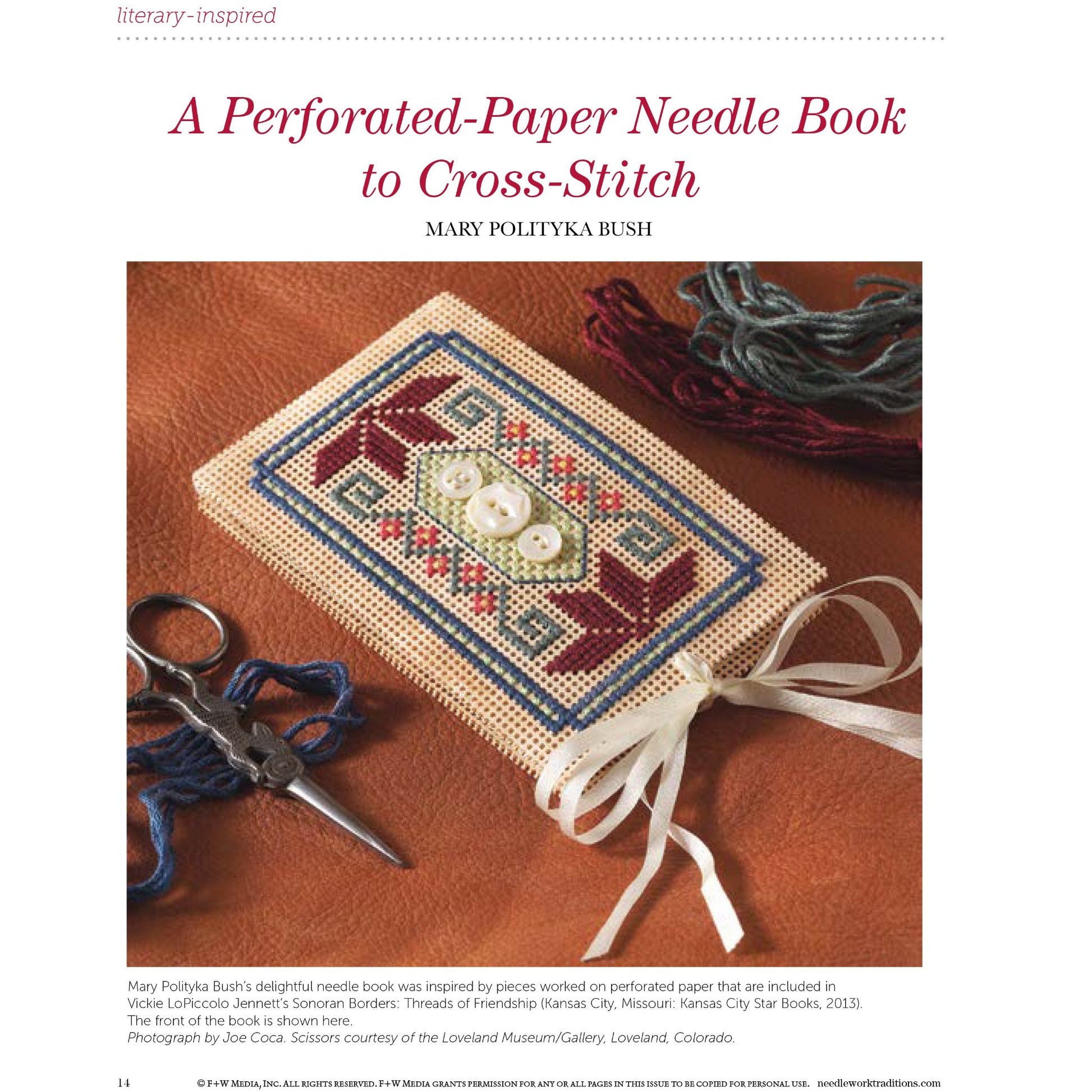 A printed copy of the eBook "PieceWork Presents: Literary-Inspired Projects to Knit, Crochet, Hook, and Cross-Stitch" by Long Thread Media is shown. It features a cross-stitched geometric pattern in red, blue, and white on perforated paper with two small white buttons attached. Next to the book are embroidery threads in various colors and a pair of scissors.