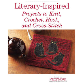 A teapot and spoon sit on a wooden table next to a red rectangular textile piece featuring three black cats. The text above reads, "PieceWork Presents: Literary-Inspired Projects to Knit, Crochet, Hook, and Cross-Stitch." The bottom text notes it's an eBook printed copy from Long Thread Media.