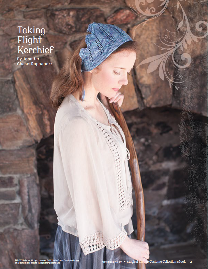 A woman clad in a delicate blouse and a blue kerchief, part of the "Magical Knitted Costume Collection – eBook printed copy" by Long Thread Media, holds a wooden staff. She rests against a stone wall with her eyes closed as decorative elements adorn the image corner. Text reads "Taking Flight Kerchief" by Jennifer Chase-Rappaport.