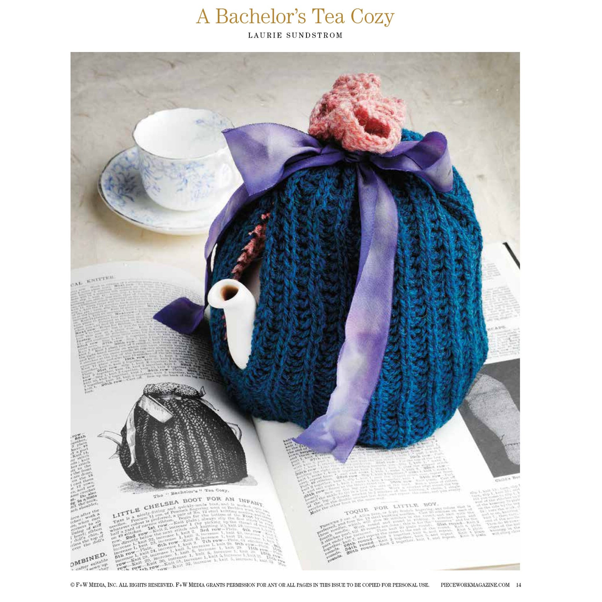 Image of a blue knit tea cozy with a purple ribbon and pink knitted rose on top, placed over a teapot. The teapot sits on an open book with a matching cup and saucer in the background. Text at the top reads, "Victorian Times: 8 Projects To Knit – eBook printed copy" by Long Thread Media.