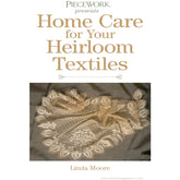 Cover page titled "Home Care for Heirloom Textiles – eBook printed copy" by Linda Moore, presented by Long Thread Media. The cover features an intricate lace textile with floral patterns placed on a grey surface, emphasizing the preservation and care of delicate vintage textiles.