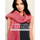 A woman with long dark hair is wearing a red knit shawl draped loosely around her neck and shoulders. She is dressed in a black top and standing against a light background. Text on the image reads, "Long Thread Media presents Handwoven Loom Theory: Eight Shaft Shawl Collection 2019 - eBook Printed Copy.