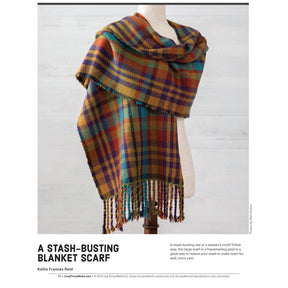 A vividly patterned plaid blanket scarf in hues of blue, green, red, and yellow is draped gracefully over a dress form. The scarf features fringed ends and looks incredibly soft and cozy. According to the text below, the accessory is identified as a stash-busting blanket scarf by Kellie Frances Reid from "Little Looms Presents: 10 Favorite Rigid Heddle Projects - eBook Printed Copy," published by Long Thread Media.