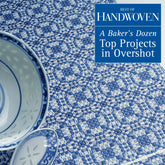 A stack of white and blue patterned bowls and a spoon rest on a beautifully crafted blue and white woven textile. Overlay text: "Best of Handwoven, A Baker's Dozen: Top Projects in Overshot eBook (Printed version) by Long Thread Media. Discover exquisite handwoven projects with captivating design innovations.