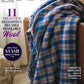 Cover of Handwoven Magazine Jan/Feb 2023 issue by Long Thread Media. The headline reads, "11 Projects in Delightful Dyeable Desirable Wool." A colorful woven blanket is draped over an armchair. Additional articles featured are on saving stash, weaving worries behind, and local yarns—plus cozy scarves and shawls.